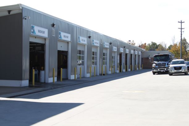 Collision repair bay with vehicle on frame equipment